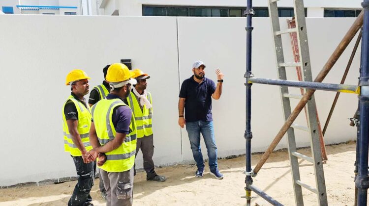 A Trainer is describing the Steel Scaffolding Training in Dubai at DAMAC Lagoons Project.