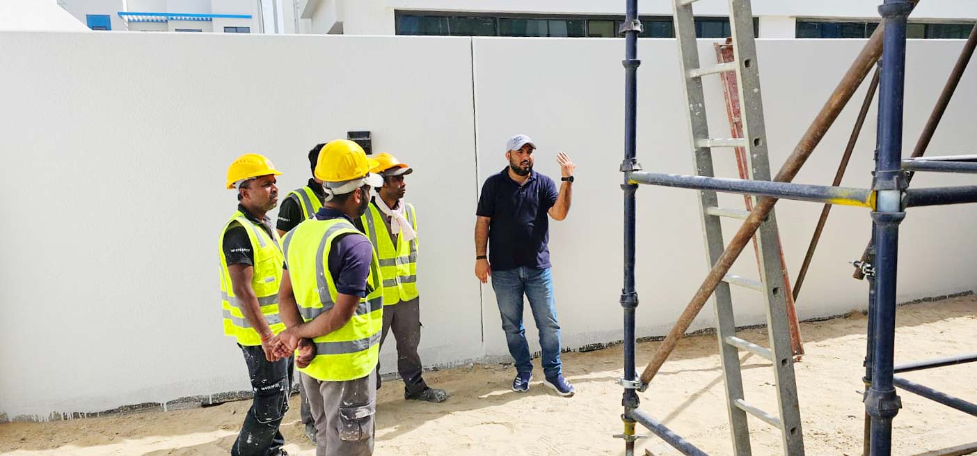A Trainer is describing the Steel Scaffolding Training in Dubai at DAMAC Lagoons Project.