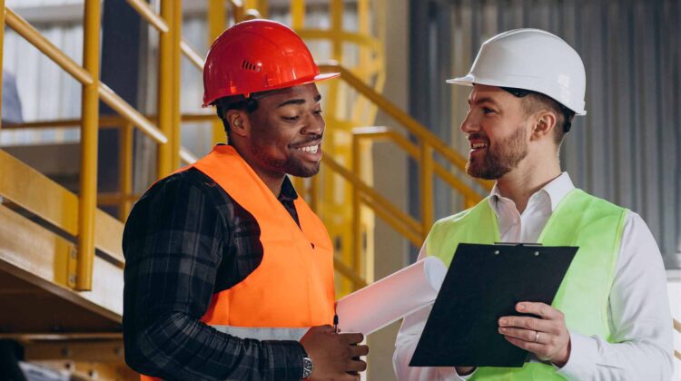 Two safety professional performing HIRA in the workplace