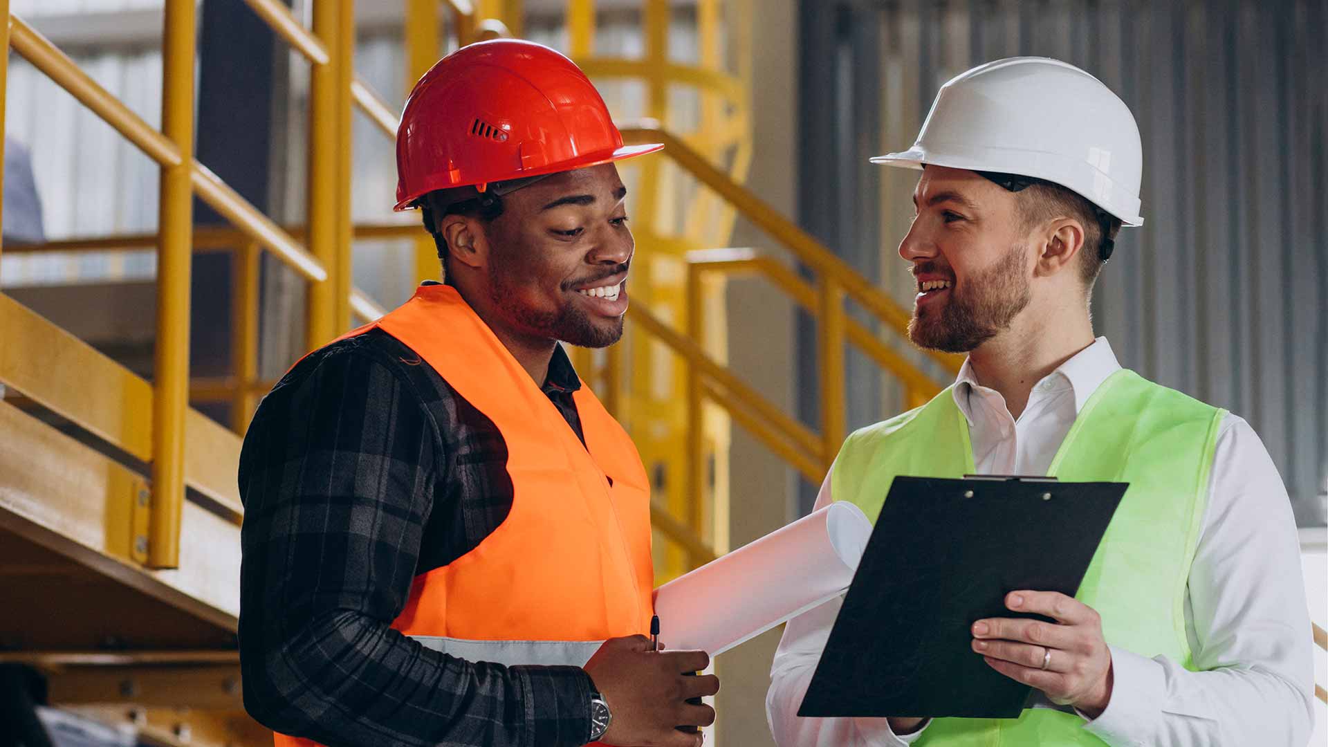 Two safety professional performing HIRA in the workplace
